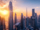Skyline mit Sonnenaufgang in Dubai Steuern für Expats